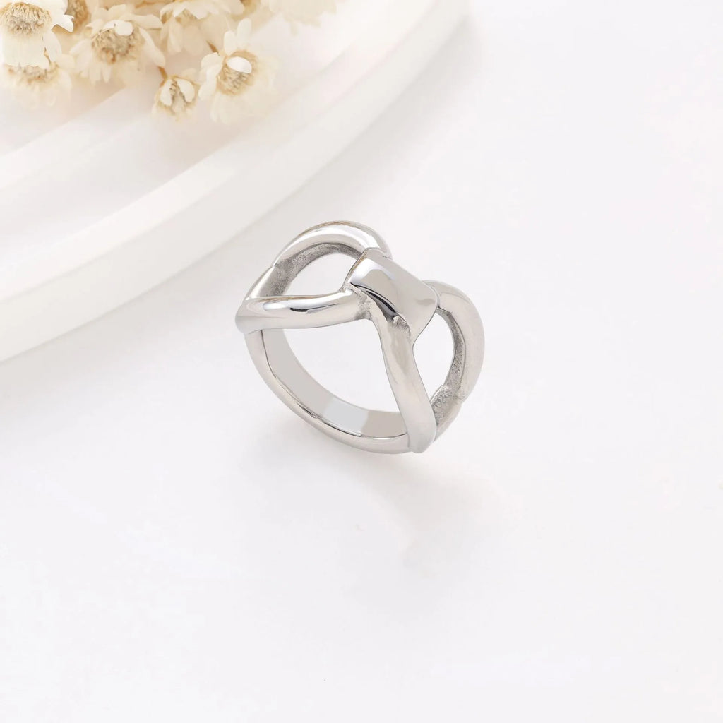 Gold titanium steel women's ring with hollow butterfly and geometric bow design.