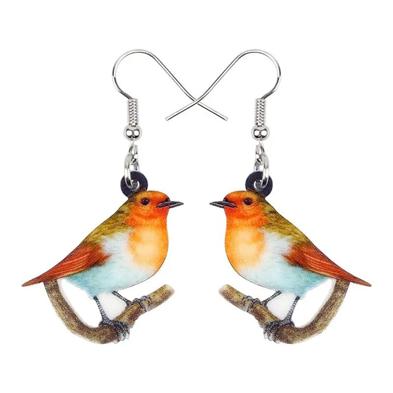 Geometric Blue Tit bird acrylic drop earrings with surgical steel posts on a white background.