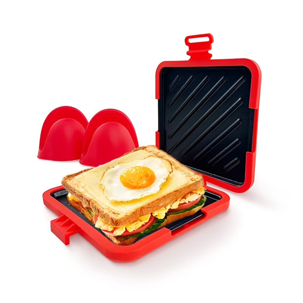 Red silicone baking tray and matching heat-resistant gloves set on kitchen counter