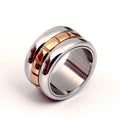 Gold titanium steel ultra-wide knuckle ring with a rotatable tail on a hand