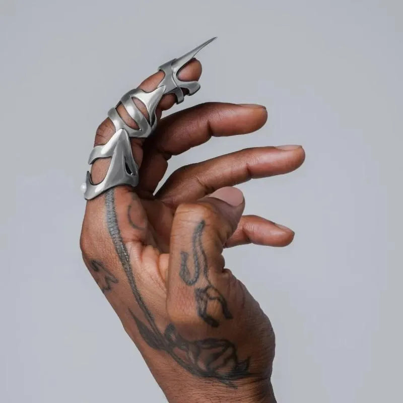 Silver alloy punk armour fashion ring designed as a finger stall.