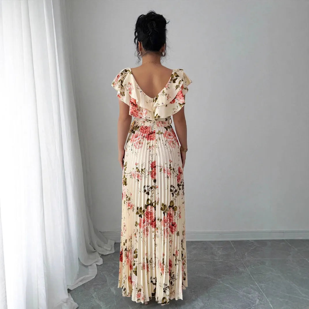 Apricot-coloured women's V-neck floral print dress with ruffled short sleeves and a long, pleated oversized swing skirt.
