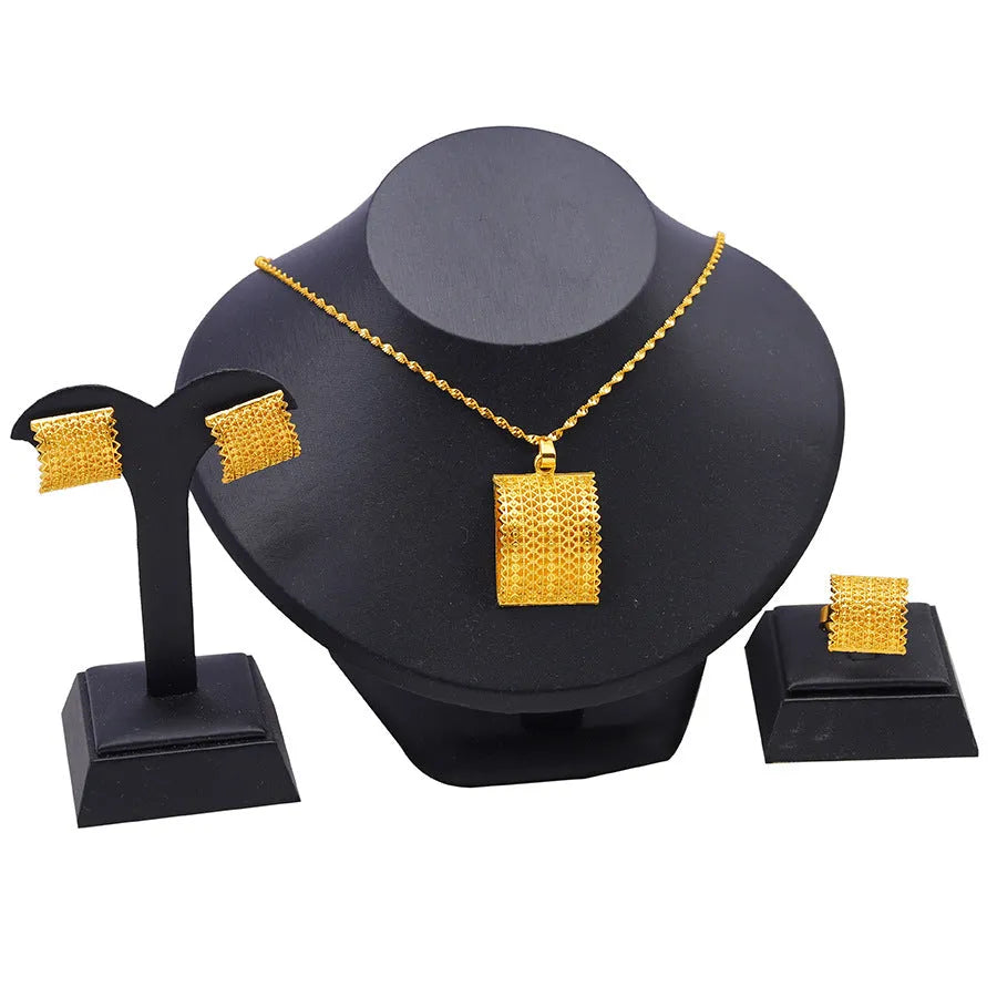 Golden bridal jewellery set with copper necklace, earrings, and ring for wedding occasions