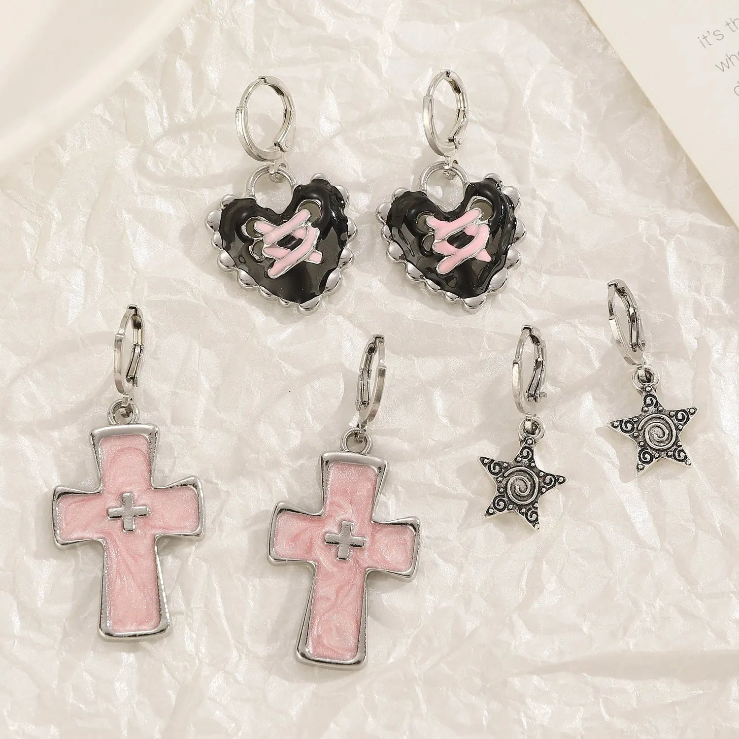 Women's classic cross crystal alloy earrings showing five colour options with cross and heart design elements