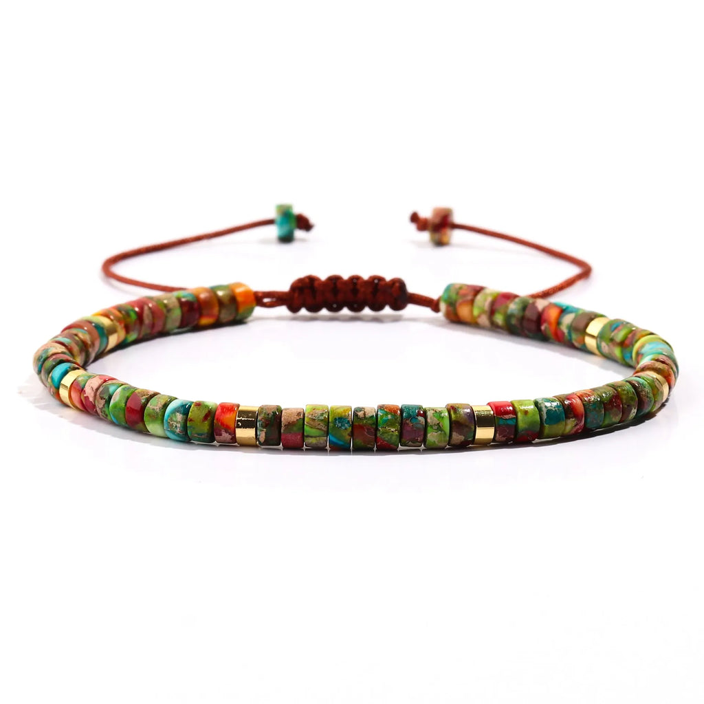 Women's hand-woven tigereye turquoise cylindrical flat bead bracelet with geometric texture and bamboo joint details