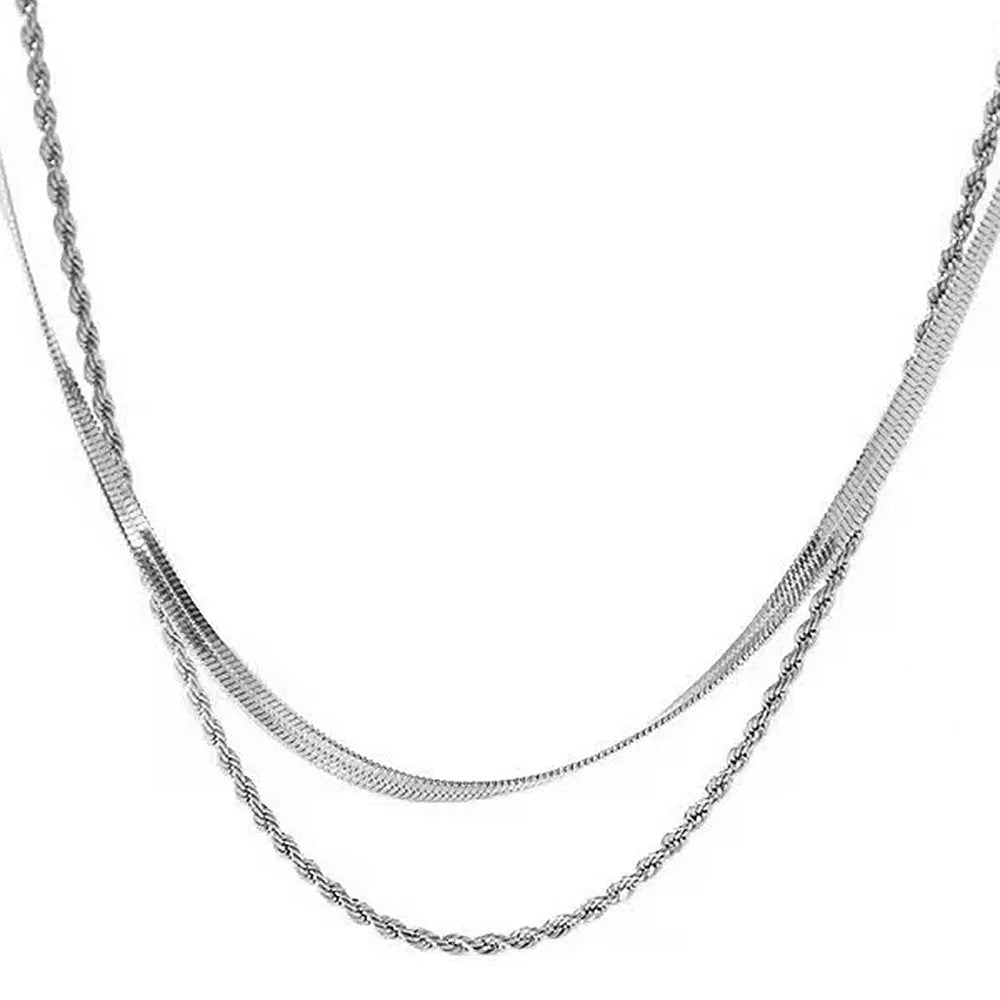 Women's silver geometric pendant necklace on a textured snake bone chain, adjustable from 21 to 50 cm.