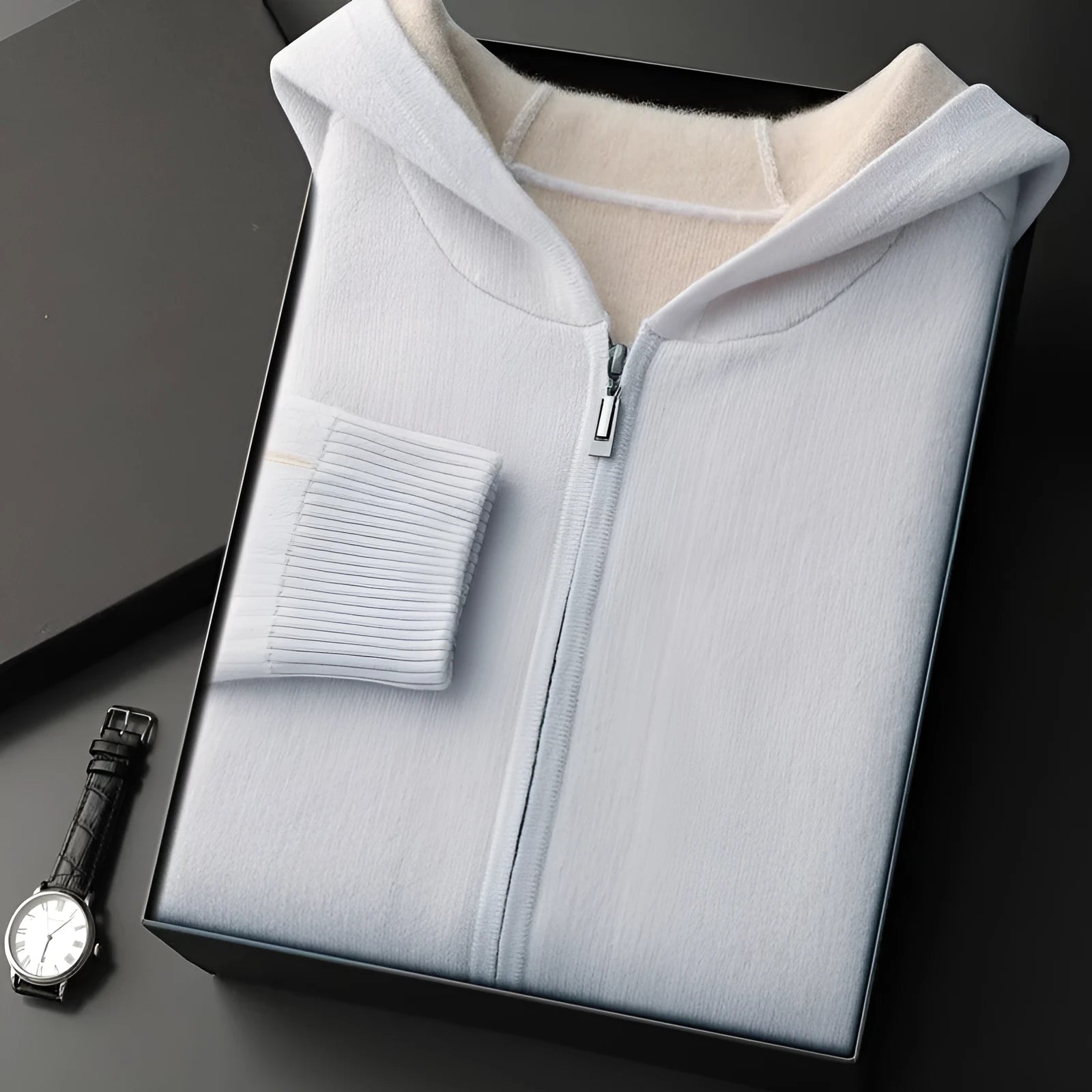 Man wearing a dark blue cashmere cardigan with a half-high collar and zippered front.