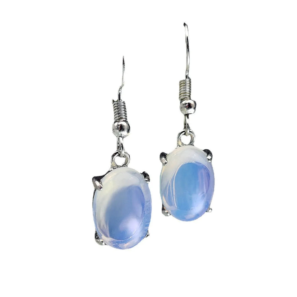 Moonlight white opal earrings with retro drop shape and cross charm detail