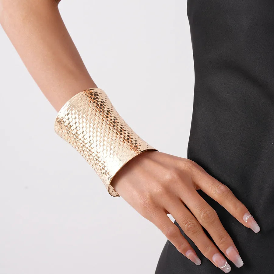 Women's vintage metal bracelet with exaggerated round design in gold colour.