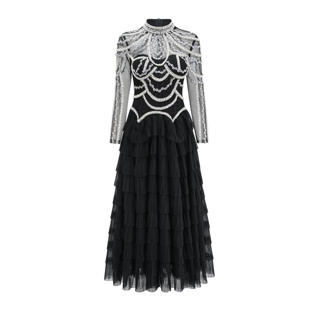 Women's black long sleeve beaded dress with a mid waist and long skirt.