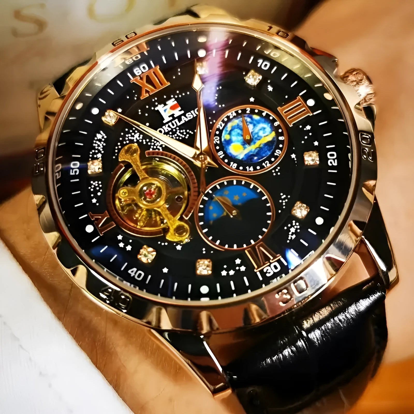 Men's black and rose gold automatic mechanical watch with hollow dial on a black leather strap.