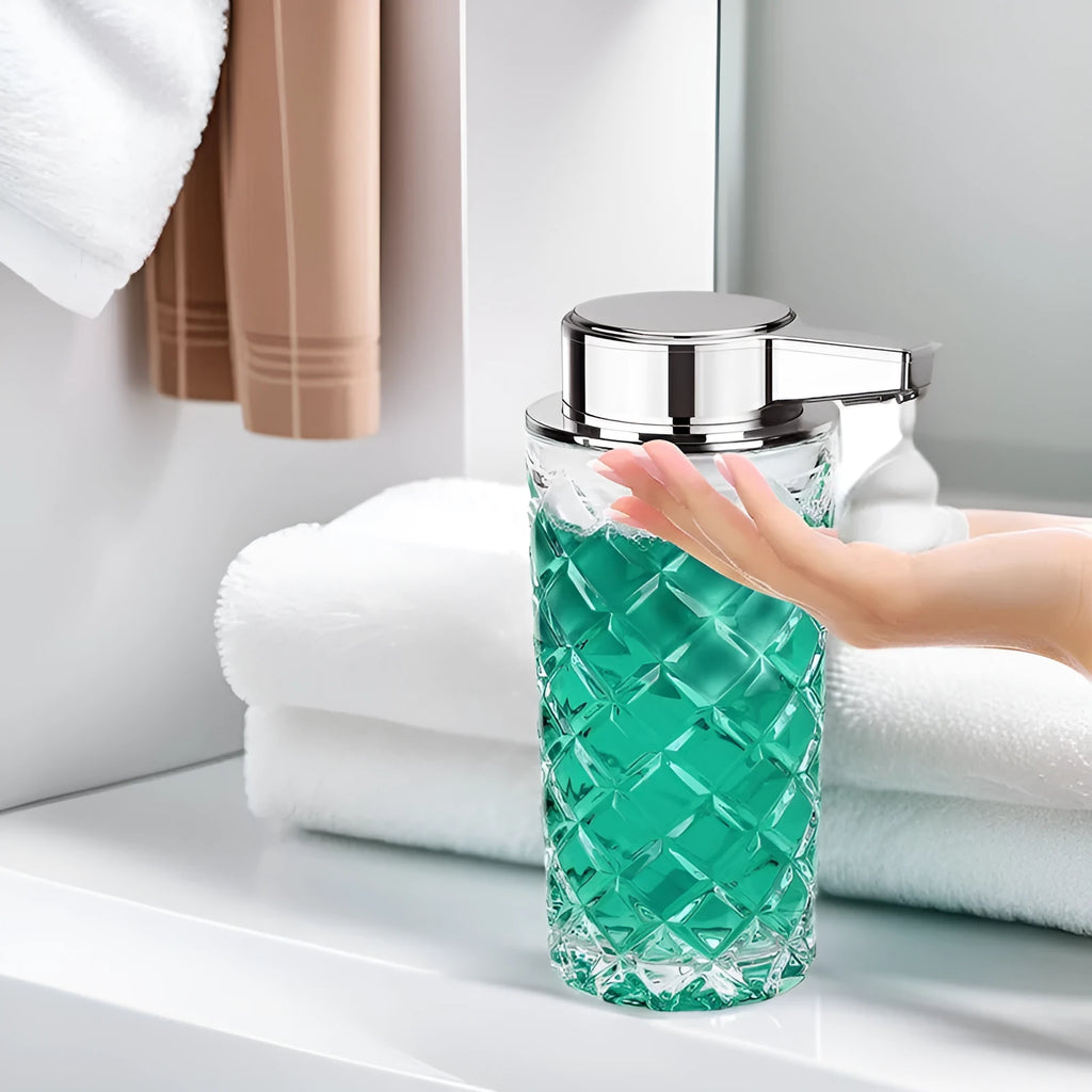 Silver automatic sensor soap dispenser with USB Type-C charging port on a bathroom counter.