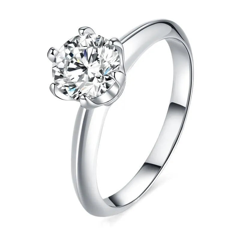 Silver Chinese-style couple's ring with dragon, phoenix, and heart design on an adjustable band.