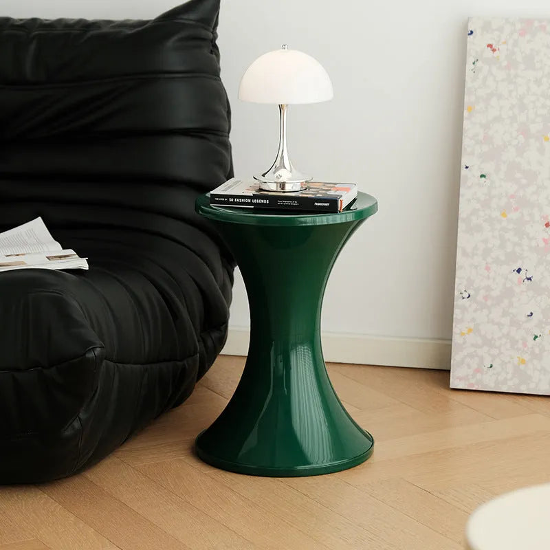 A plastic hourglass-shaped shoe changing stool in a choice of five colours.