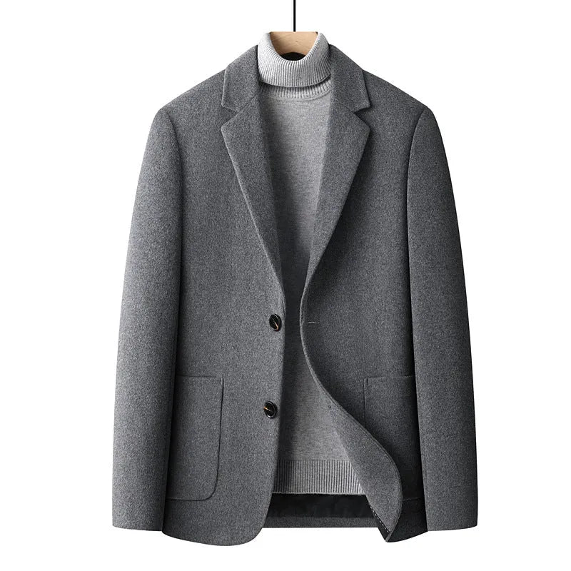 Men's slim fit wool suit jacket in grey on a hanger.