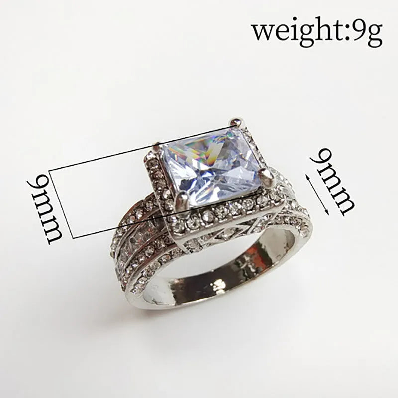 Geometric round women's alloy ring on a hand, showing angular design in gold or white electroplated finish.