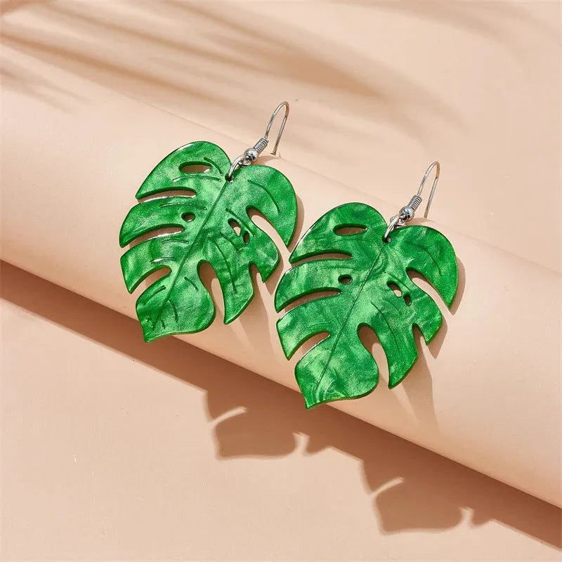 Women's drop earrings with a colourful acrylic coconut jackfruit charm on a metal hook.