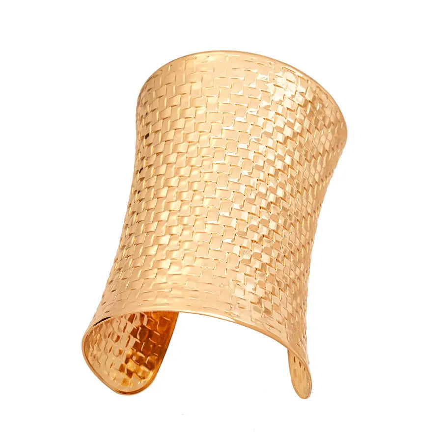 Women's vintage metal bracelet with exaggerated round design in gold colour.