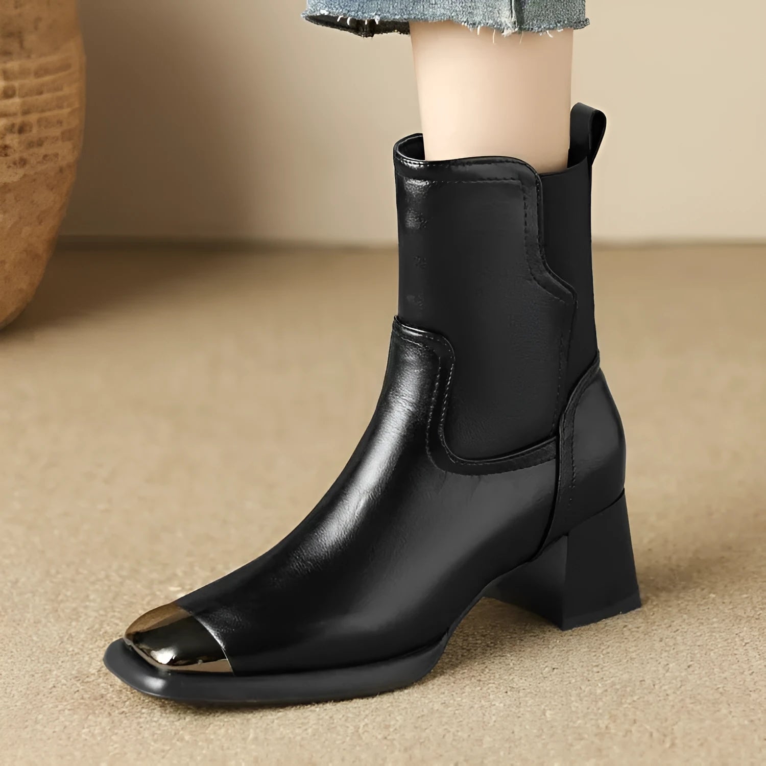 Brown cowhide leather women's Martin boots with high heel and side zipper on a white background.