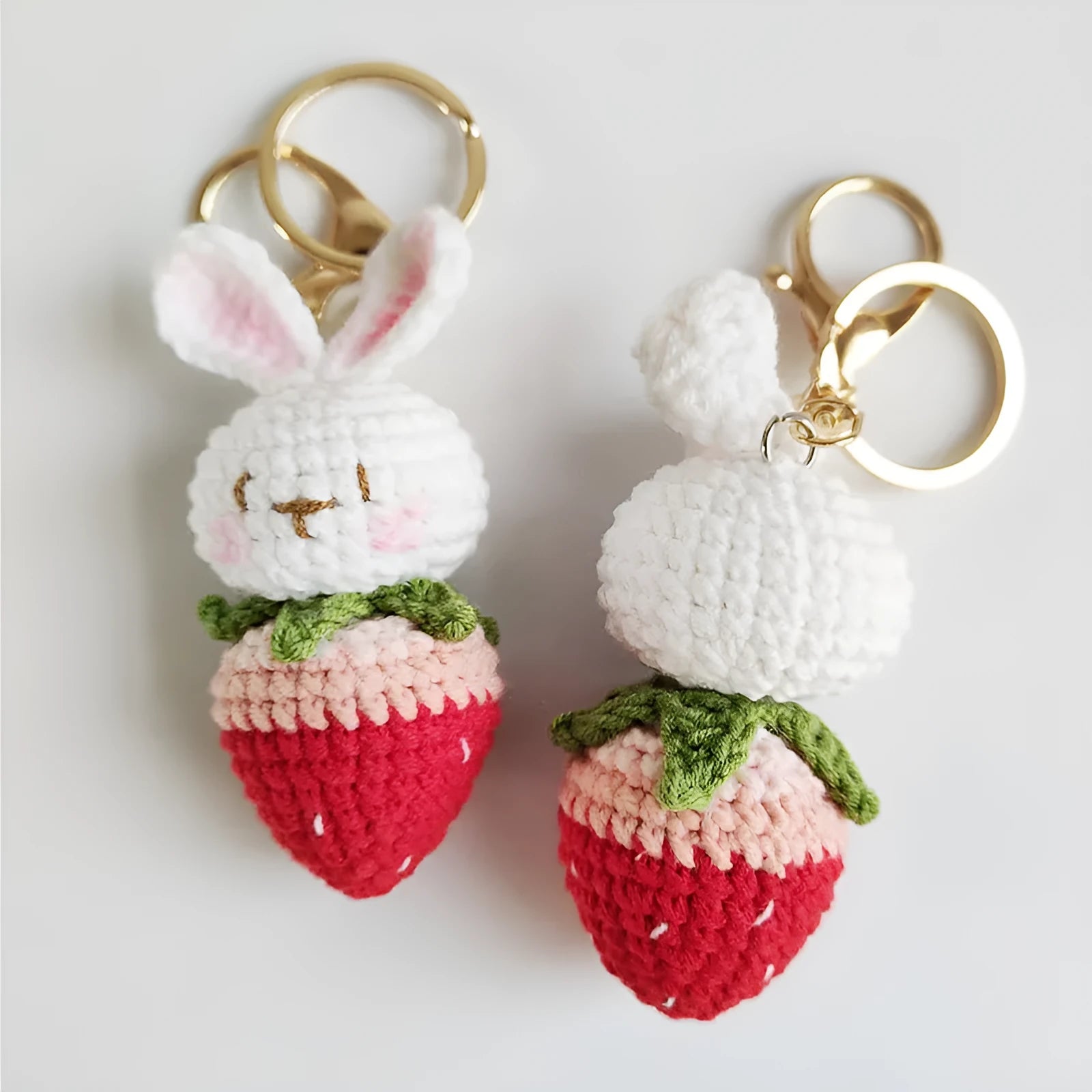 Hand-woven white rabbit strawberry pendant charm made from colourful doll wire on a keyring.