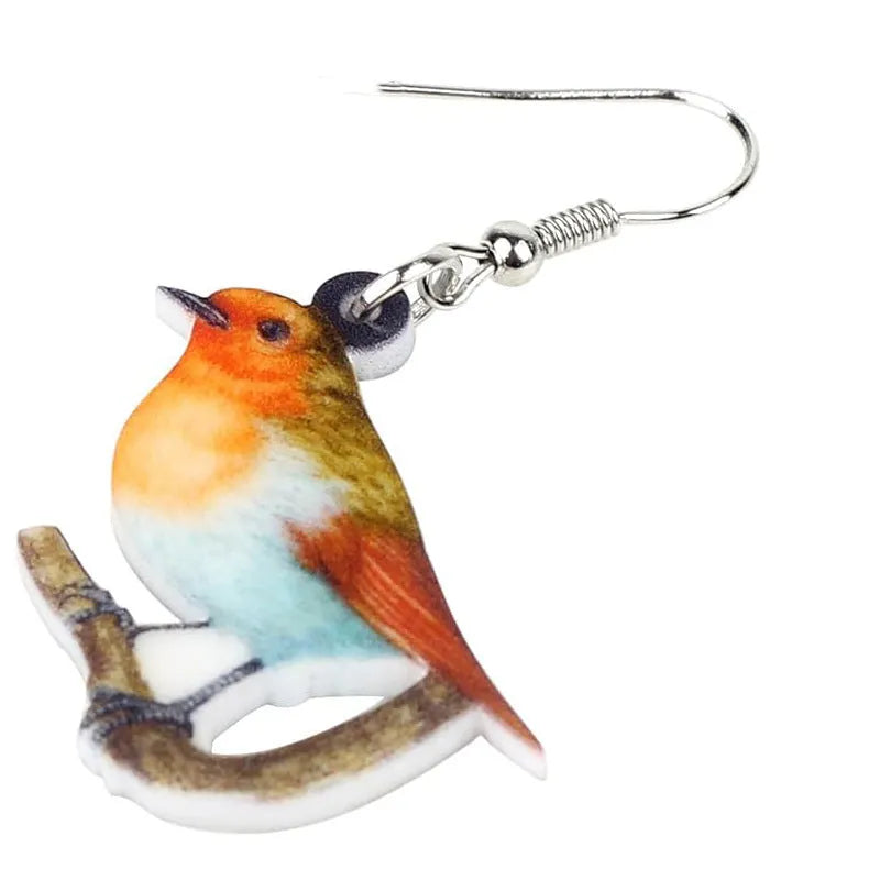 Geometric Blue Tit bird acrylic drop earrings with surgical steel posts on a white background.