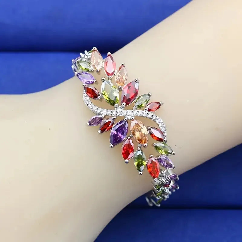 Gold-plated copper bracelet with coloured zircon stones in an ice flower design.