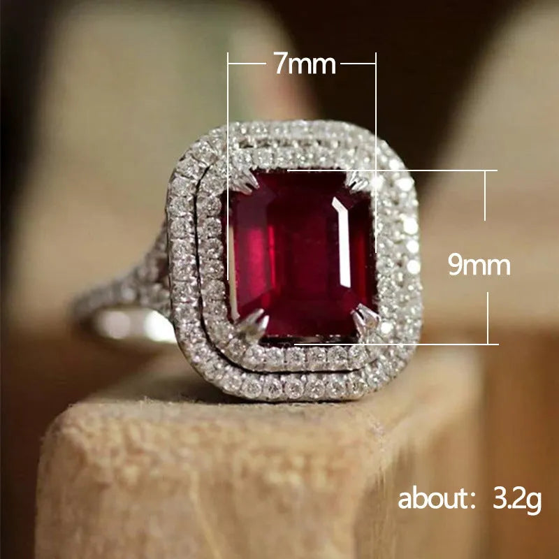 Women's copper square ring with red rhinestones, shown in a geometric princess cut design.