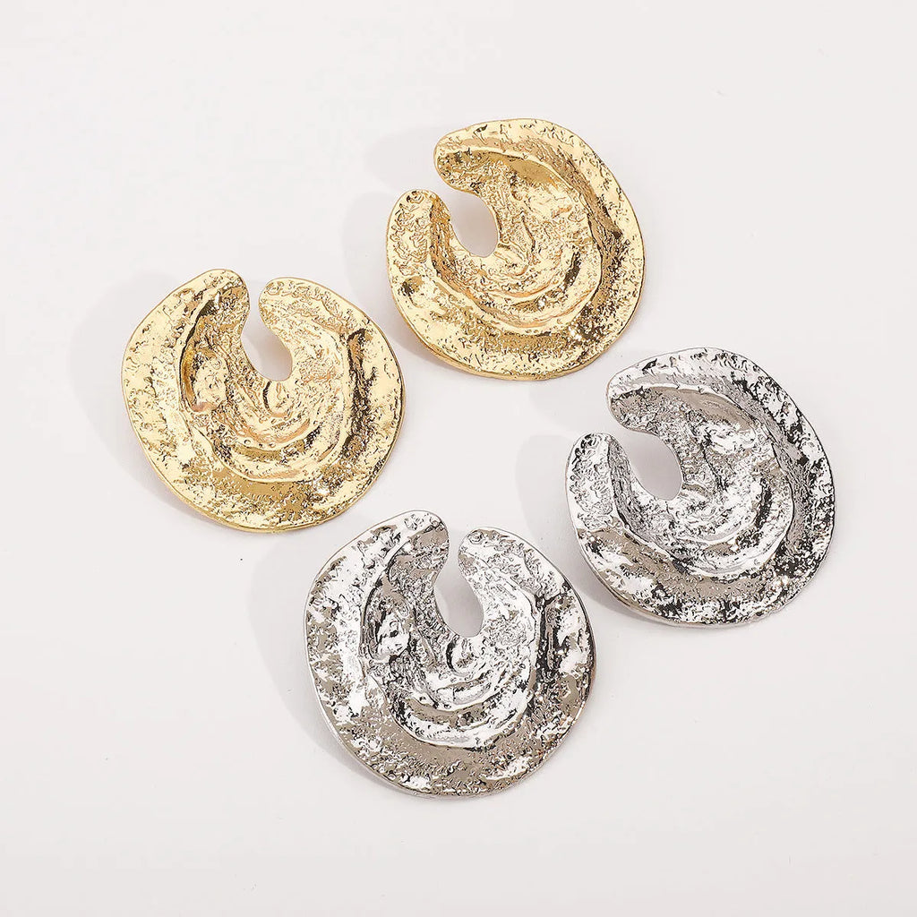 Exaggerated geometric women's earrings with irregular pleating and cold concave-convex texture in gold finish