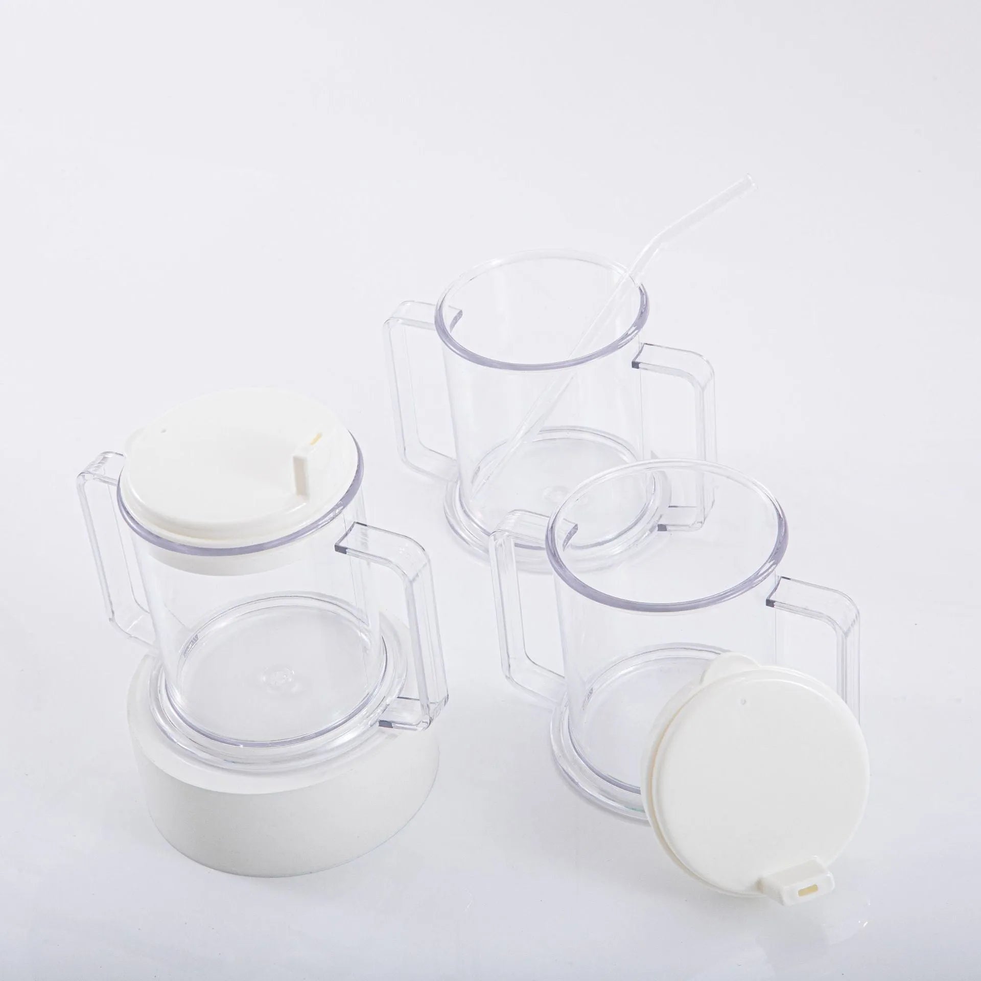 Transparent plastic drinking cup with a simple, modern design on a plain background.