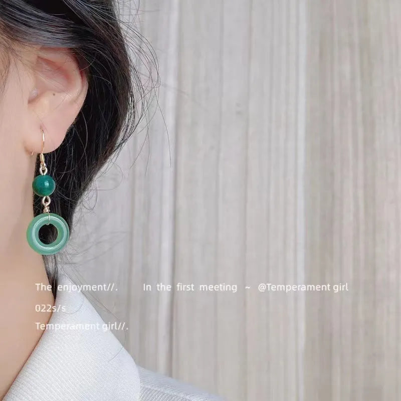 Green and gold Chinese style earrings with cheongsam peace buckle design in geometric shape