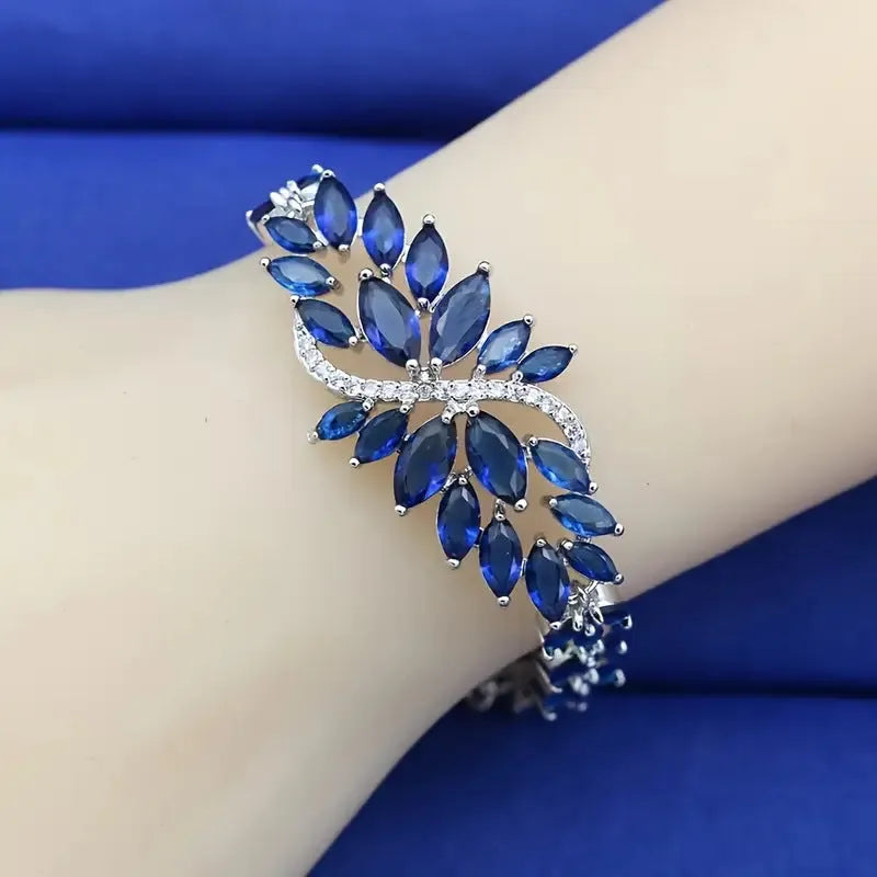 Gold-plated copper bracelet with coloured zircon stones in an ice flower design.