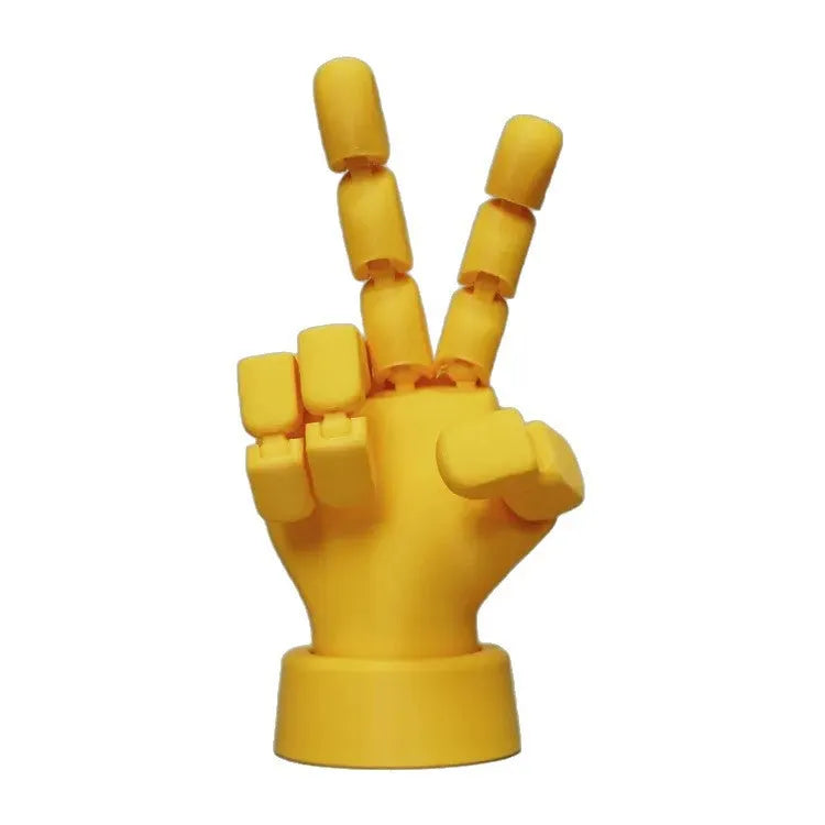 Yellow movable joint hand prop figurine for cosplay and photography on a white background.