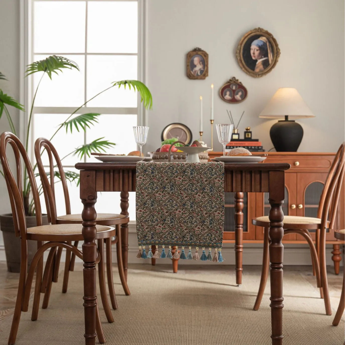 Rhyme Nordic striped jacquard table runner with tassel fringe in dark blue on a wooden table.