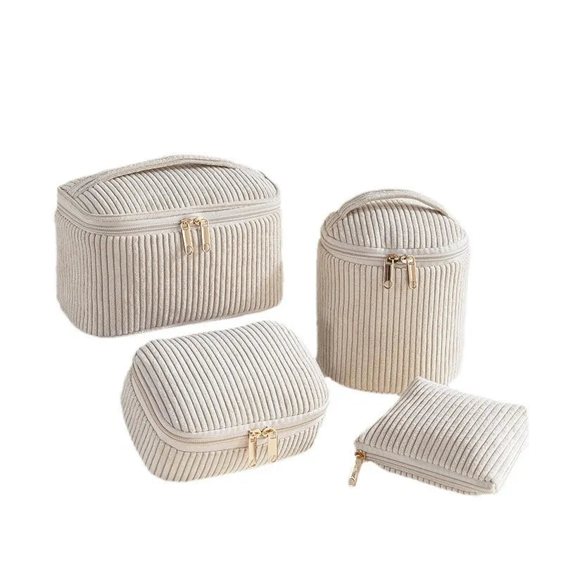 Flannelette makeup bag travel set showing cube-shaped main bag and three smaller zip pouches in a blue with white dots colourway.