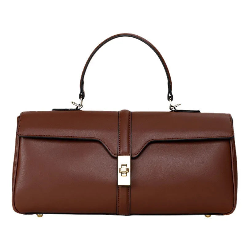 Genuine cowhide leather women's messenger bag in cylindrical suitcase shape with internal organisation compartments