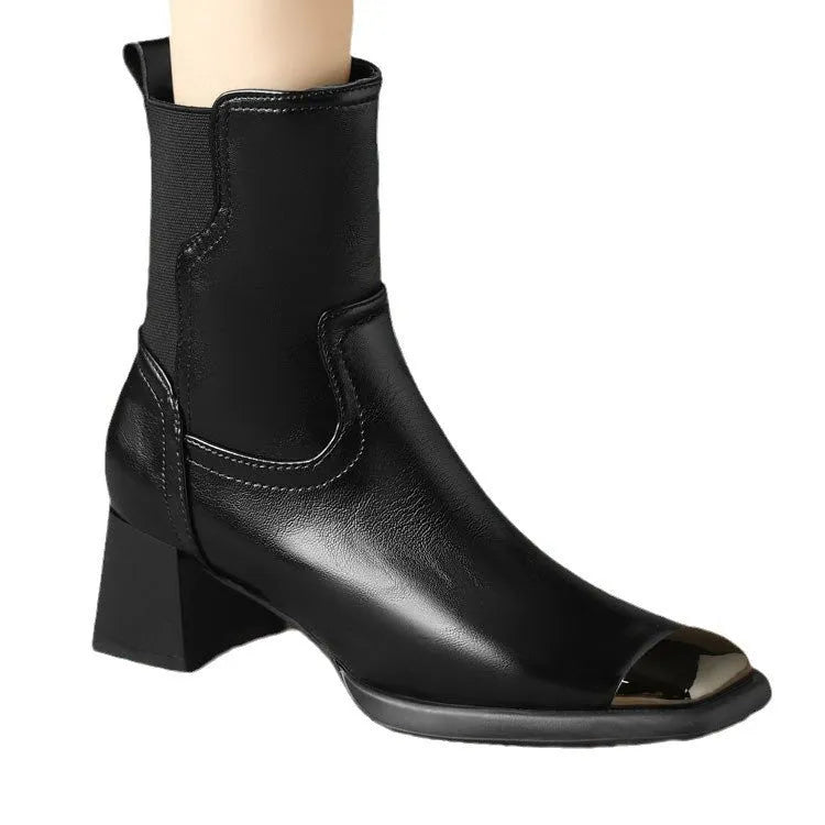 Brown cowhide leather women's Martin boots with high heel and side zipper on a white background.
