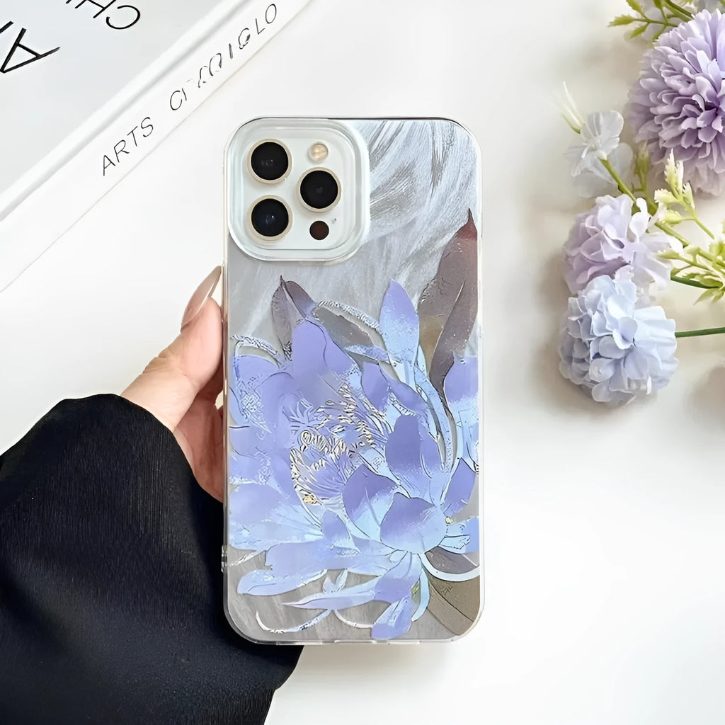 Hard polycarbonate iPhone case with blue lotus floral IMD pattern showing screen and camera cut-outs