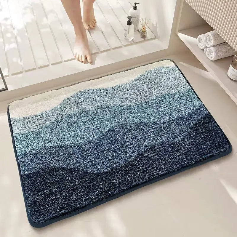Square rainbow pattern floor mat in sky sea colour with a flat polyester weave and plastic backing