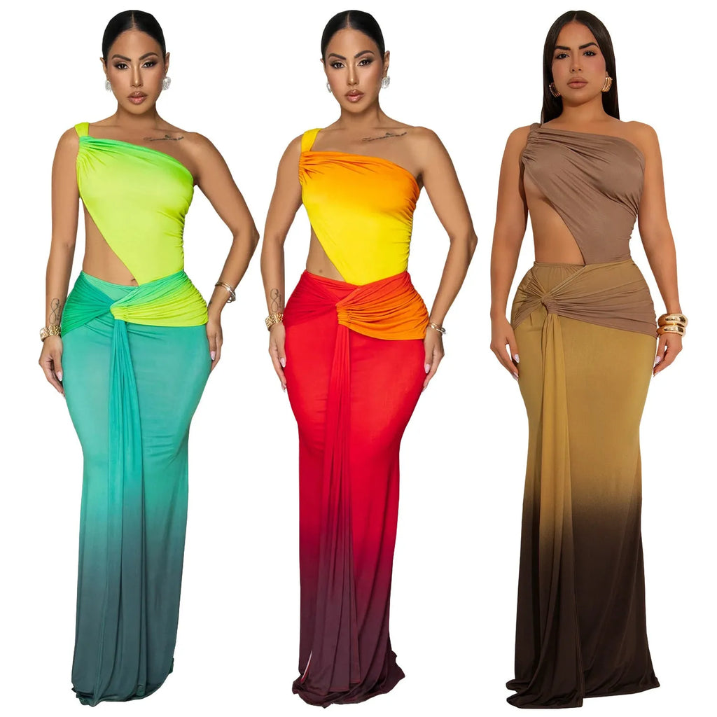 A woman wearing a long gradient colour dress with a cross-shoulder sleeveless design and high waist.