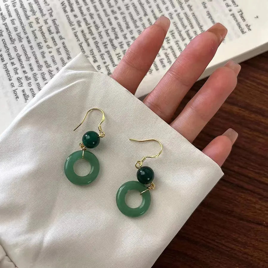 Green and gold Chinese style earrings with cheongsam peace buckle design in geometric shape