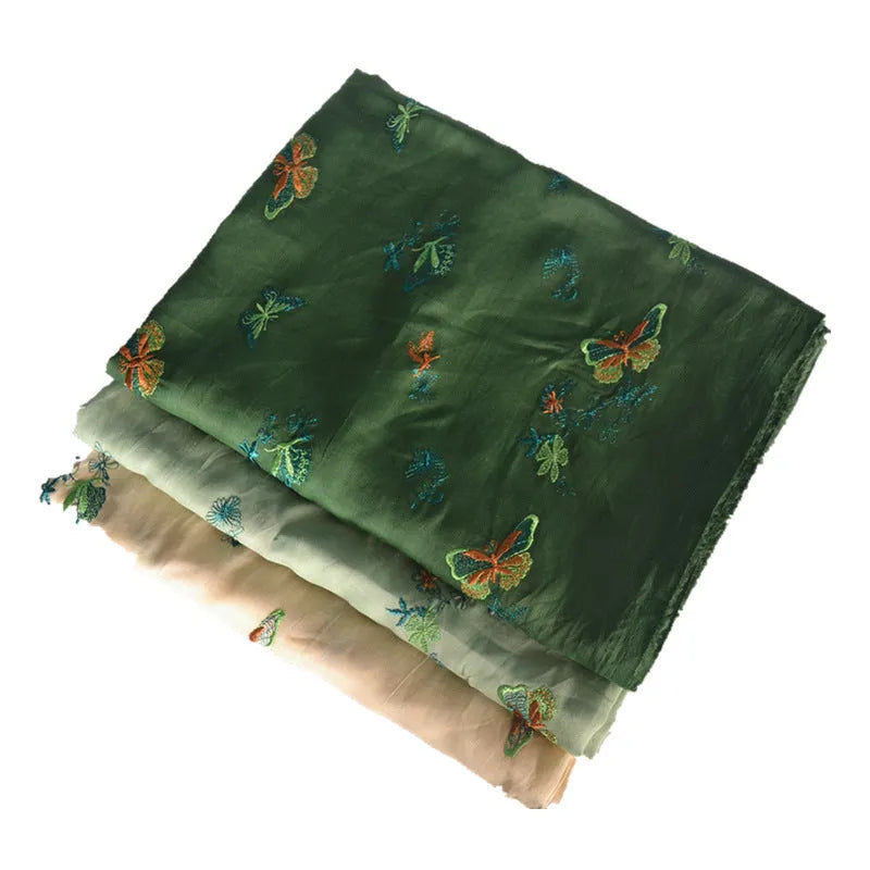 Pure ramie fabric swatch in beige, dark green, and grass green colours showing texture.