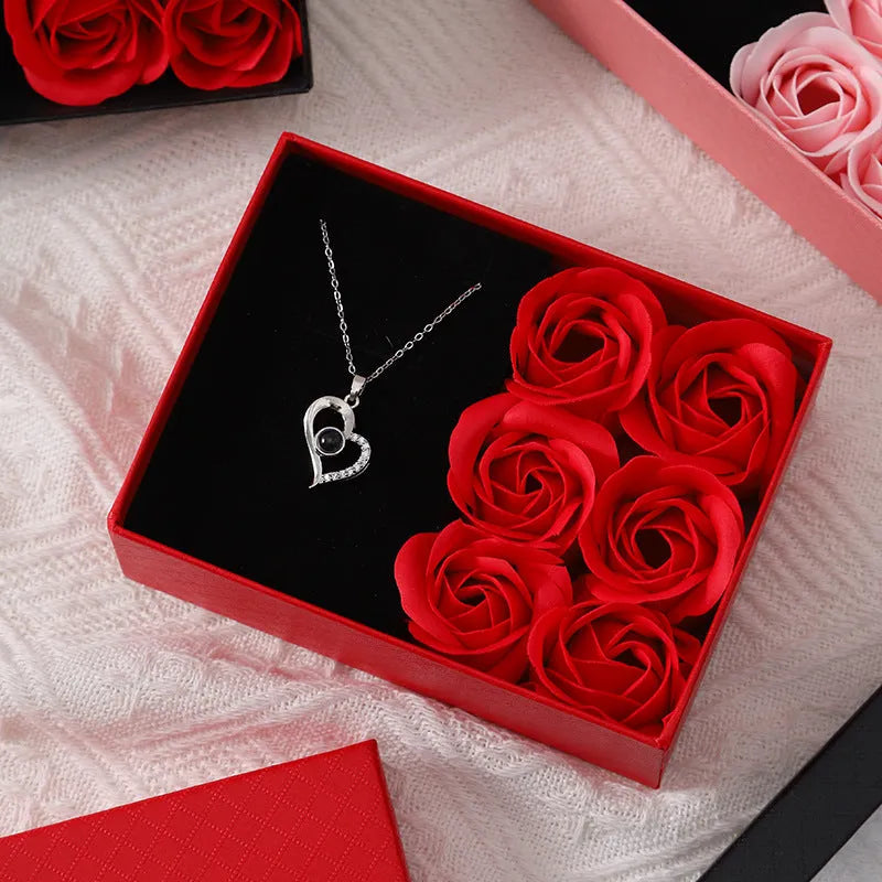 Six red soap roses in a black Korean-style gift box with a matching handbag