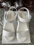 Women's beige peep toe platform sandals with an ankle-strap buckle on a white background.