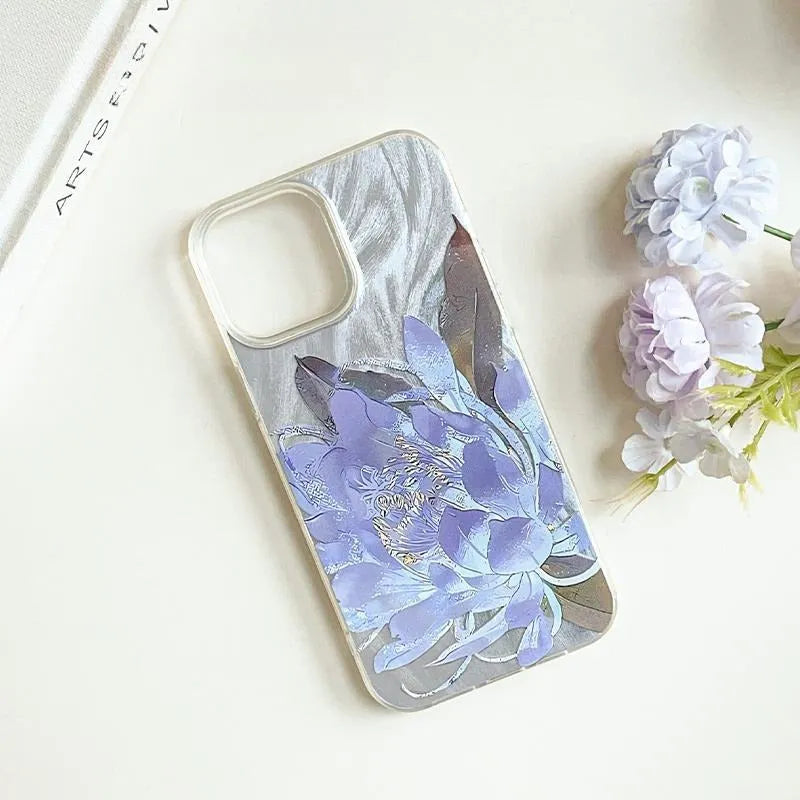 Hard polycarbonate iPhone case with blue lotus floral IMD pattern showing screen and camera cut-outs