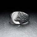 Men's silver geometric wolf head alloy ring on a black background, showing side and top views.