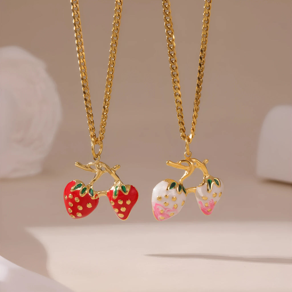 Strawberry fruit charm necklace in red or white gradient on a silver-toned chain.