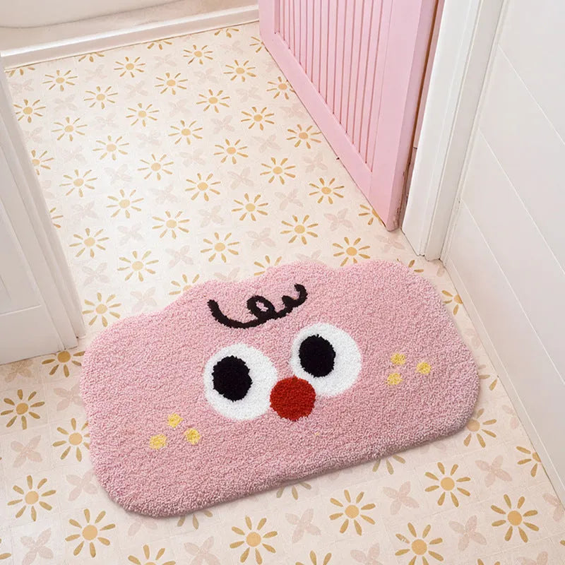 Big eye clouds cartoon print bathroom mat in green, showing soft, thickened polyester fibre pile.