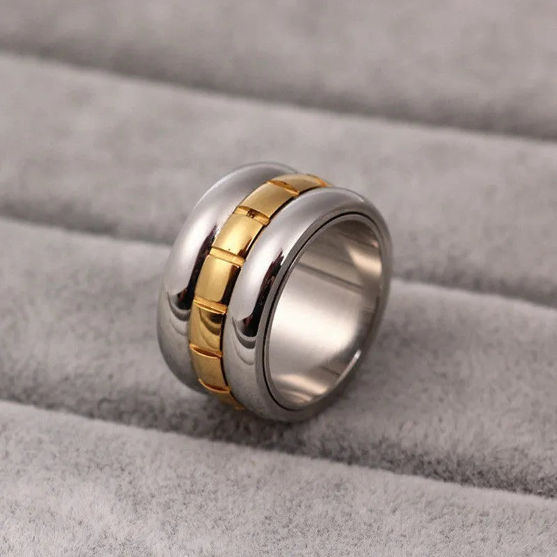 Gold titanium steel ultra-wide knuckle ring with a rotatable tail on a hand