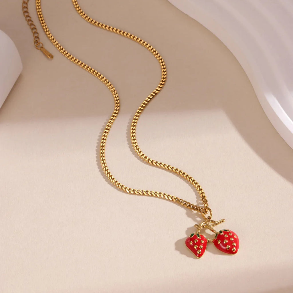 Stainless steel necklace with a strawberry-shaped pendant in red or white gradient colour.