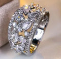 Round hollow women's fashion ring in copper, shown in platinum white and gold blue colour options.